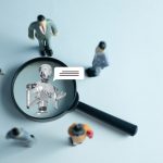 The interaction between humans and AI. Miniature figures represent a team or customers engaging with a robot virtual assistant, symbolizing the future of communication and technology.