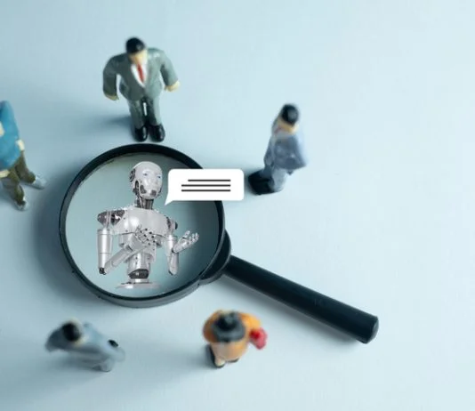 The interaction between humans and AI. Miniature figures represent a team or customers engaging with a robot virtual assistant, symbolizing the future of communication and technology.