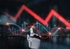 This image captures the intersection of technology and market analysis in a modern workspace. Synapse. AI collapsing the cost concept