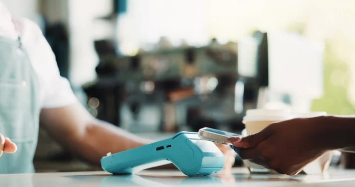 People, hands and phone in cafe with POS machine, eft transaction or bill payment for hospitality. Cashier, customer service and tech in restaurant with digital banking, purchase or cashless transfer POS Testing machine