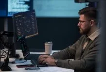 DevOps of Softalium Limited working in the office