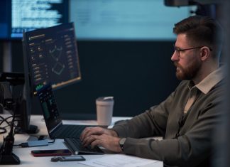 DevOps of Softalium Limited working in the office