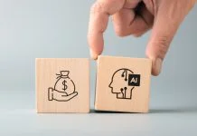Hand placing an AI block next to a money symbol, representing AI adoption, income generation, business opportunities, productivity improvement, and technology driven growth
