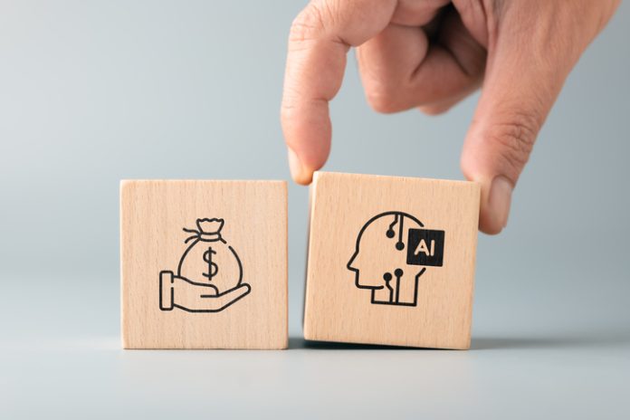 Hand placing an AI block next to a money symbol, representing AI adoption, income generation, business opportunities, productivity improvement, and technology driven growth