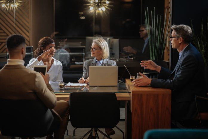 Business professionals collaborating in a modern office meeting CFO