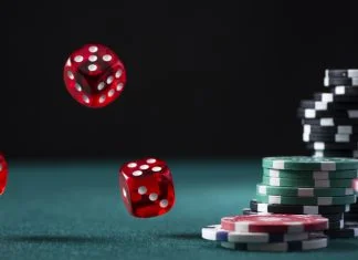 What Makes Finland One of Europe’s Most Interesting iGaming Markets? iGaming Markets - Casino Chips Stack and Flying Dices on Green Poker Table.