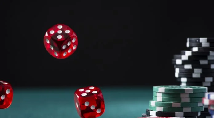 What Makes Finland One of Europe’s Most Interesting iGaming Markets? iGaming Markets - Casino Chips Stack and Flying Dices on Green Poker Table.
