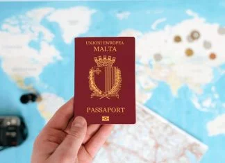 Where Can Malta Passport Holders Travel Without a Visa in 2026? Malta Passport holding in hand with map