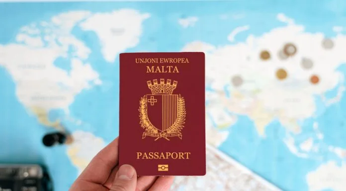 Where Can Malta Passport Holders Travel Without a Visa in 2026? Malta Passport holding in hand with map