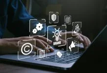 Designing Global Brands Without Flattening Them: Why Cultural Relevance Always Beats Creative Consistency Man using laptop for brand marketing and management, branding concept.