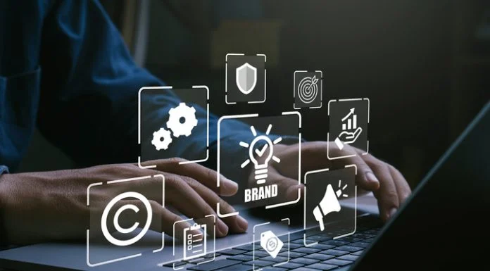 Designing Global Brands Without Flattening Them: Why Cultural Relevance Always Beats Creative Consistency Man using laptop for brand marketing and management, branding concept.