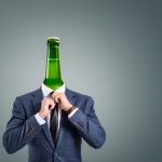 A surreal composition depicting a businessman with a green bottle as his head.