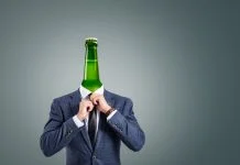 A surreal composition depicting a businessman with a green bottle as his head.