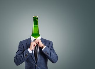 A surreal composition depicting a businessman with a green bottle as his head.
