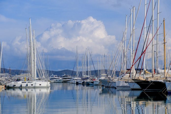 Rows of sailing yachts and Catamaran boats moored up for the winter in Olympic Marina Athens yacht charter