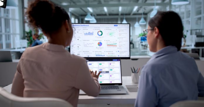Diverse Group Of Women Monitoring Data Compliance dashboard governance