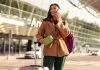 woman talking on the phone after arrival while traveling, reward from Travel Loyalty