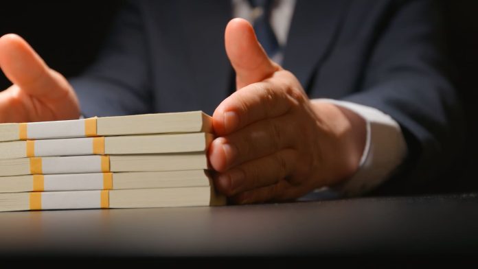 iStock-654107082 (1) Beyond the Numbers - touches money bundle