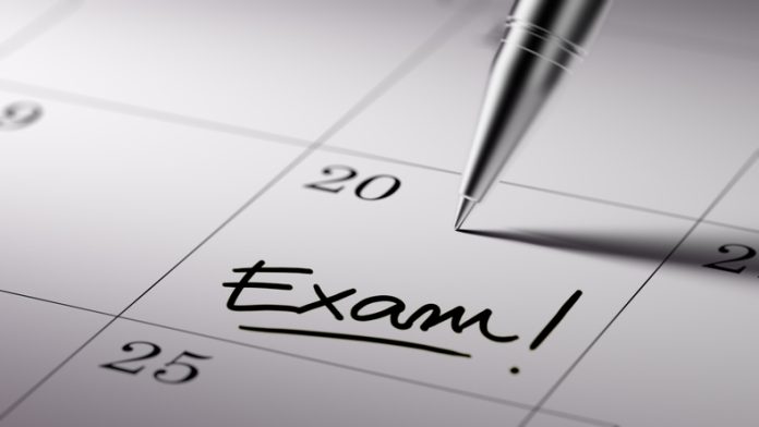 Calendar Concept marking exam date in the calendar