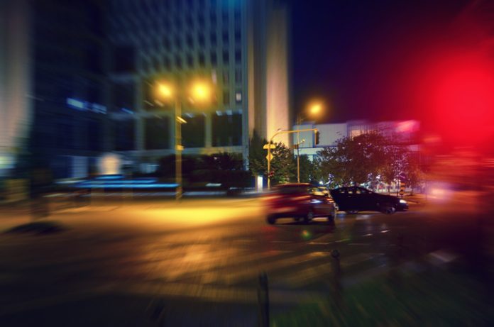 Car accident. Car running through red light on the intersection and hitting another car. hit-and-run crash