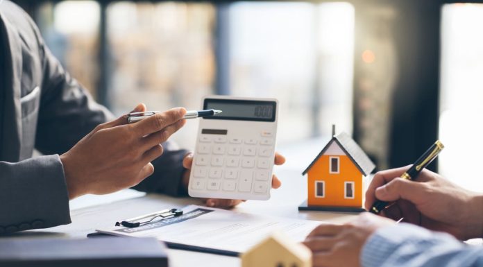 Why Financial Guidance Matters Before Buying Your Next Investment Property Financial Guidance Matters - House model with agent