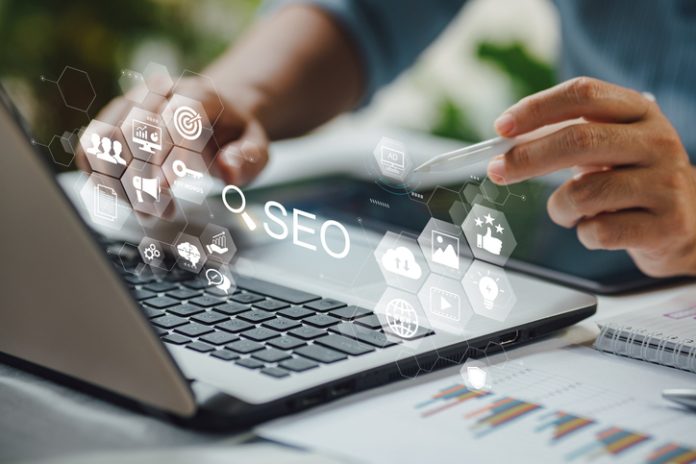 Person working with search engine optimization : SEO with social media content and advertisement from website. SEO services San Francisco