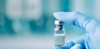 Understanding Peptide Receptor Binding Assays: How Researchers Measure Molecular Affinity Peptide Receptor Binding - holding glass vial