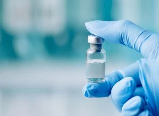 Understanding Peptide Receptor Binding Assays: How Researchers Measure Molecular Affinity Peptide Receptor Binding - holding glass vial