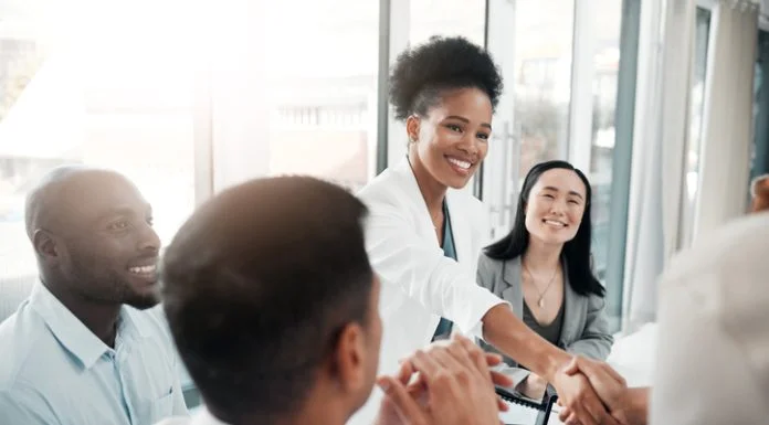 The Best Fixed-Fee Recruitment Partners for Funded Startups in 2026 Recruitment partners concept. Diversity, human resources and black woman doctor shaking hands in welcome or thank you.