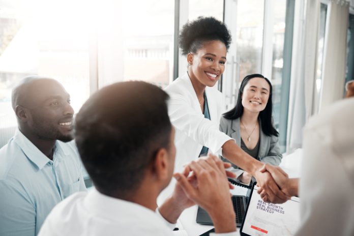 Recruitment partners concept. Diversity, human resources and black woman doctor shaking hands in welcome or thank you.