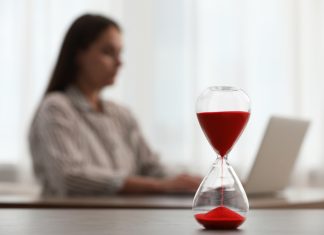 From Time Management to Value Management: Investing Your Time Where It Matters Most Woman using laptop indoors, selective focus for time management