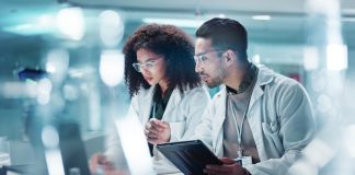 Why the Next Frontier in Healthcare May Be Getting More From Every Molecule Science, teamwork and laptop with laughing in laboratory for communication, pharmaceutical review or planning. Employees, collaboration and technology for research, discussion and digital analysis. Molecule in Healthcare.