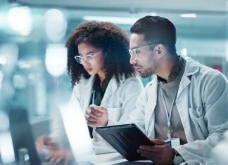 Why the Next Frontier in Healthcare May Be Getting More From Every Molecule Science, teamwork and laptop with laughing in laboratory for communication, pharmaceutical review or planning. Employees, collaboration and technology for research, discussion and digital analysis. Molecule in Healthcare.