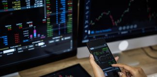 How Charting Tools are Reshaping Retail Trading Businessman checking stock market data. Retail Trading concept