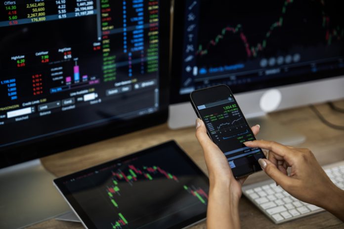 Businessman checking stock market data. Retail Trading concept