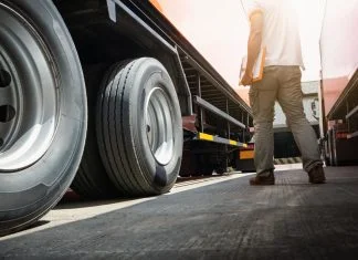 Why A Reliable Heavy Duty Trailer and Truck Bed Manufacturer Matters for Your Fleet Reliable Heavy Duty Trailer - Trailer Truck on Parking Lot