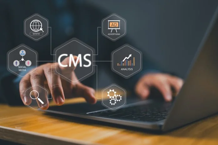 CMS, Content management system concept. Person using laptop with virtual screen for content management system icon for business website management. enterprise CMS