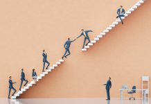 Businessman jumping between platforms in order to get the better professional position