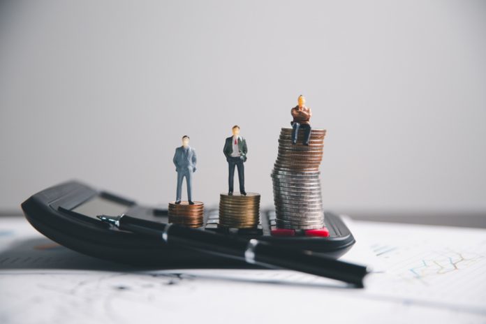 Financial calculate accountant blur background close up on calculator with graph chart banner bank office desk. Finance Concept tax banking money expense accounting budget, market presence, businessman use calculator.