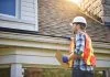 How Roof Design Shapes Home Value - inspecting house roof