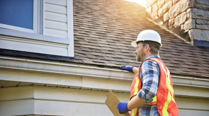 How Roof Design Shapes the Look and Value of Your Home How Roof Design Shapes Home Value - inspecting house roof