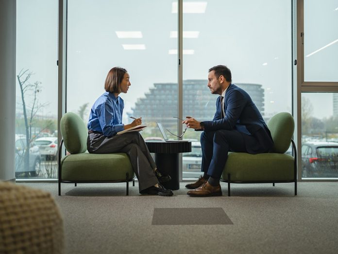 Business people discussing during a corporate meeting in modern office silent leadership
