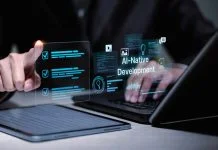 Software developer using laptop and tablet for AI-native development.