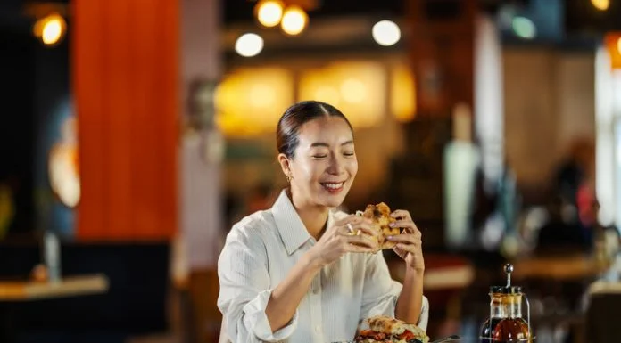 Woman eating in her Favourite Restaurant that Feels Like Home