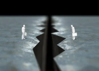 Are We Facing “A Crisis of Insularity” or Has Management Simply Rediscovered the Moon? 3D illustration of cliff with figures arranged. Crisis of Insularity concept