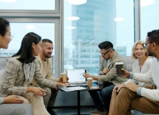 What Is Remote Desktop and How It Supports Business Continuity Planning Diverse group of business professionals collaborating in a modern office meeting