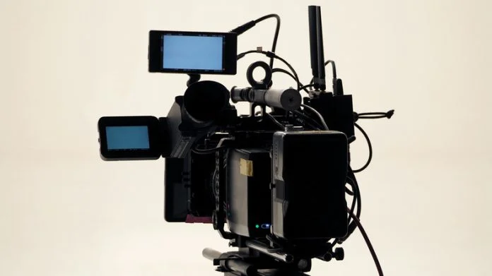 4K high defination video camera with tripod shooting in studio production and no people. Video Production