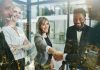 Why Client Approval Becomes a Creative Bottleneck - woman with handshake