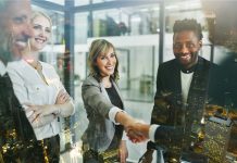 Why Client Approval Becomes a Bottleneck as Creative Work Scales Why Client Approval Becomes a Creative Bottleneck - woman with handshake