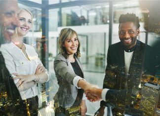 Why Client Approval Becomes a Bottleneck as Creative Work Scales Why Client Approval Becomes a Creative Bottleneck - woman with handshake